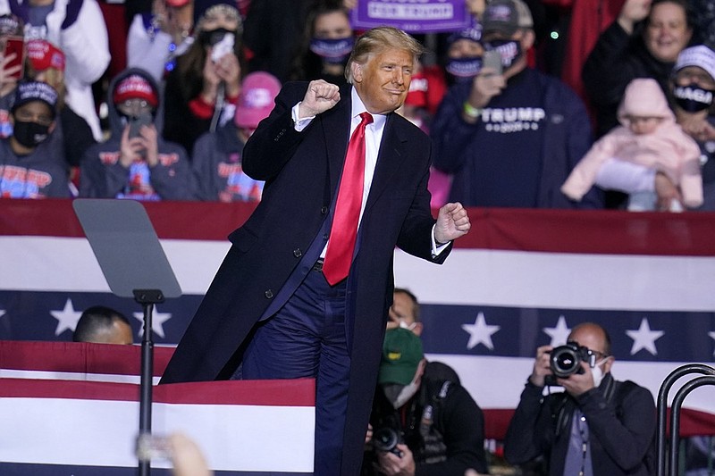 President Donald Trump moves to the song YMCA as he finishes a campaign rally at John P. Murtha Johnstown-Cambria County Airport in Johnstown, Pa., Tuesday, Oct. 13, 2020. (AP Photo/Gene J. Puskar)

