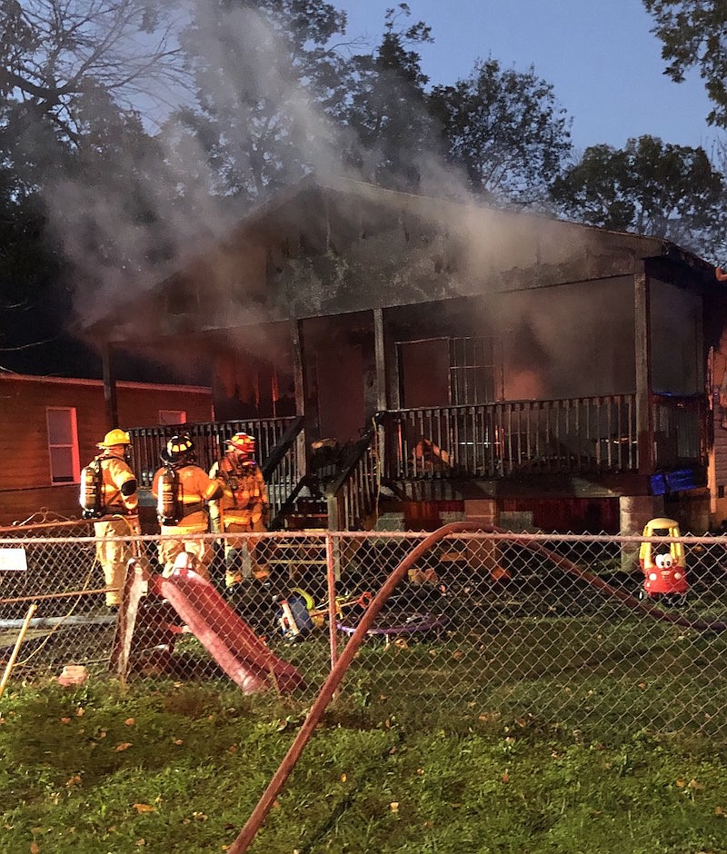 Firefighters work to extinguish a house fire in the 2000 block of Camden Street in Chattanooga on Friday, Oct. 30, 2020. / Photo from Battalion Chief Carlos Hampton, Chattanooga Fire Department