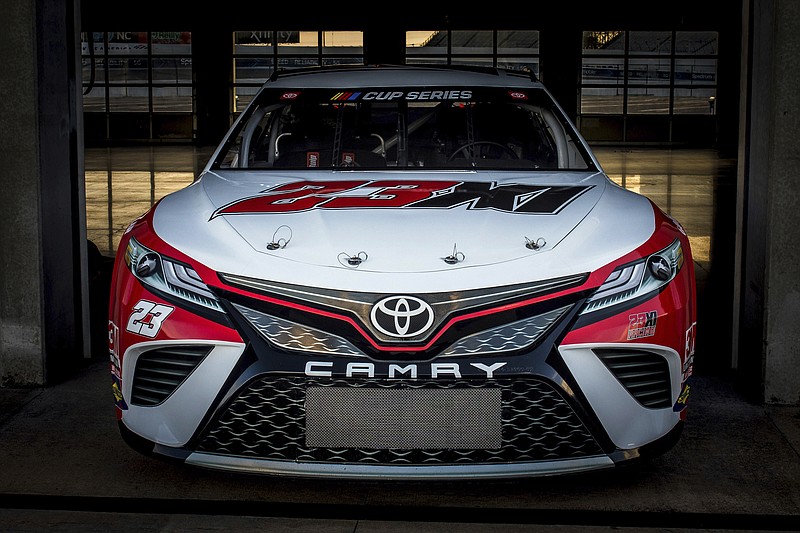 Toyota Racing photo via AP / NASCAR driver Denny Hamlin and basketball legend Michael Jordan have partnered to form 23XI racing, which will run the No. 23 Toyota Camry in Cup Series competition next year in its debut season.