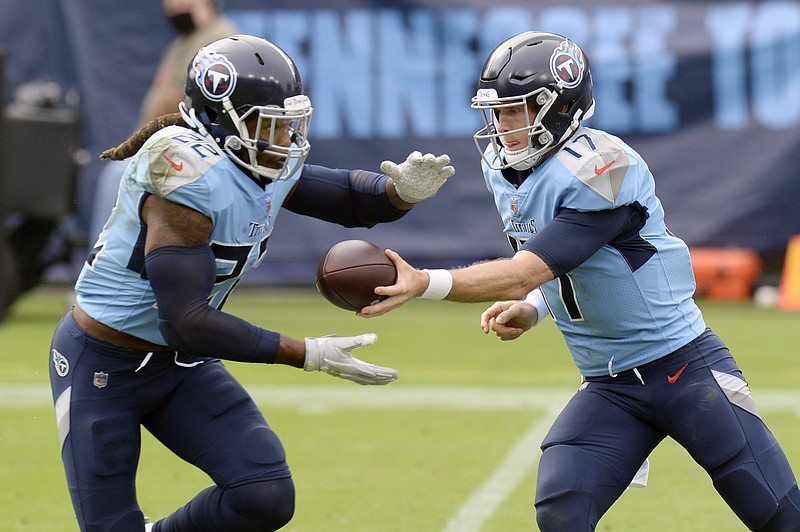 AP photo by Mark Zaleski / Tennessee Titans quarterback Ryan Tannehill hands off to Derrick Henry in the first half of last Sunday's home loss to the Pittsburgh Steelers.