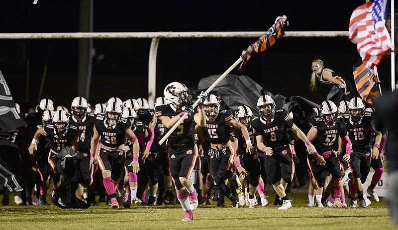 Staff Photo by Robin Rudd / The Tigers take the field.  The South Pittsburg Pirates visited the Meigs County Tigers at the school's Jewell Field on Friday, October 9, 2020, in Decatur, Tenn.