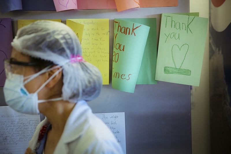 In this May 29, 2020, file photo, letters of thanks from students adorn the walls of a break room that was set up for workers to decompress from the stresses of caring for COVID-19 patients at Elmhurst Hospital, in New York. As the coronavirus pandemic surges across the nation and infections and hospitalizations rise, medical administrators are scrambling to find enough nursing help — especially in rural areas and at small hospitals. (AP Photo/Robert Bumsted, File)