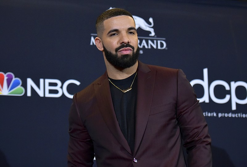 This May 1, 2019 file photo shows Drake at the Billboard Music Awards in Las Vegas. Earning his 21st No. 1 hit on Billboard's R&B/Hip-Hop songs chart, Drake has bested a record previously held by icons Aretha Franklin and Stevie Wonder. Drake's "Laugh Now Cry Later," featuring rapper Lil Durk, reached the No. 1 spot on the chart this week. Wonder and Franklin, who died in 2018, each have had 20 songs top the chart. (Photo by Richard Shotwell/Invision/AP, File)