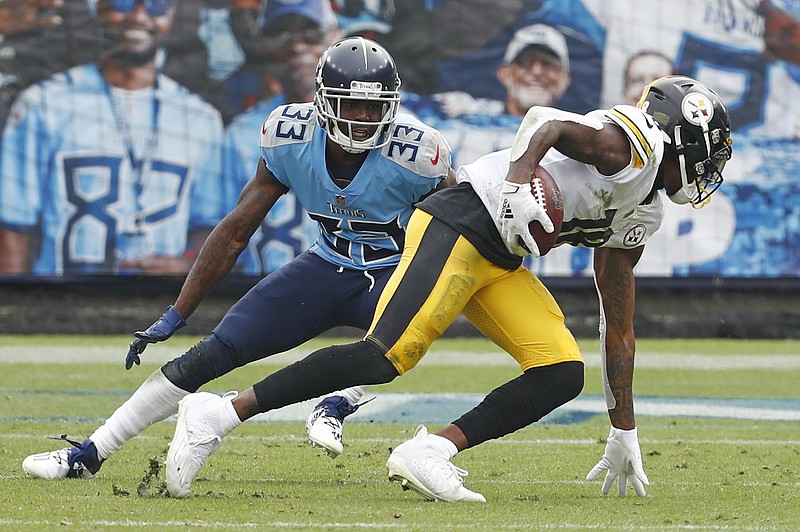 AP photo by Wade Payne / Pittsburgh Steelers wide receiver Diontae Johnson, right, gets past Tennessee Titans cornerback Johnathan Joseph to score a touchdown on Oct. 25 in Nashville. The Titans waived Joseph on Monday, one of a series of moves made to retool the defense with the regular season almost halfway over and their struggles on that side of the ball mounting.