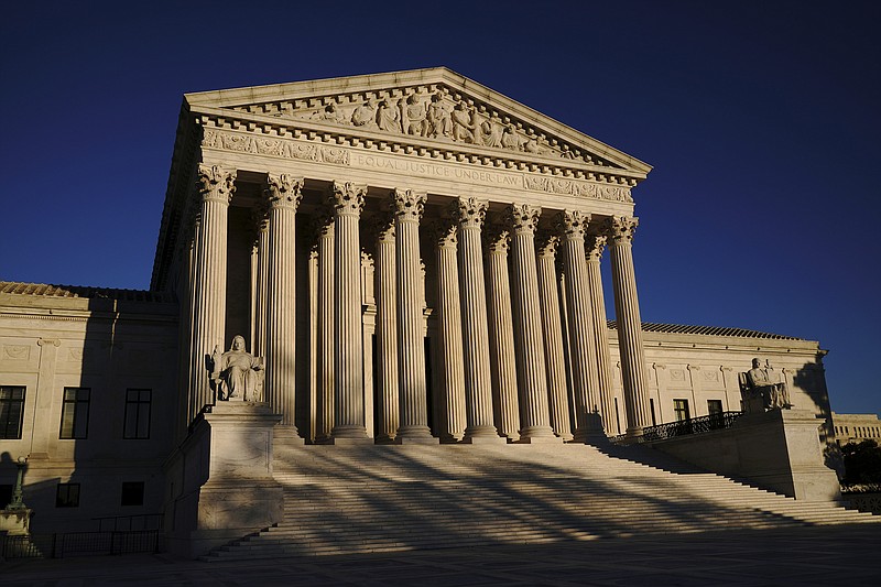 In this Monday, Nov. 2, 2020, file photo the Supreme Court is seen at sundown on the eve of Election Day, in Washington. The Supreme Court is to hear arguments in a case that could put the brakes on what has been a gradual move toward more leniency for children who are convicted of murder. (AP Photo/J. Scott Applewhite, File)