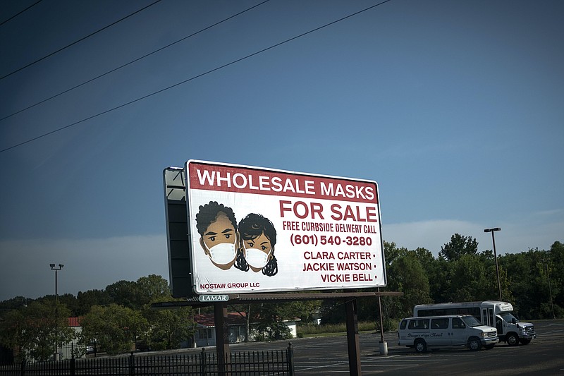 Associated Press photo by Wong Maye-E/Entrepreneurs advertise face masks for sale on a billboard in Jackson, Mississippi, last month. The COVID-19 pandemic is spurring new start-ups and new thinking about both jobs and education.