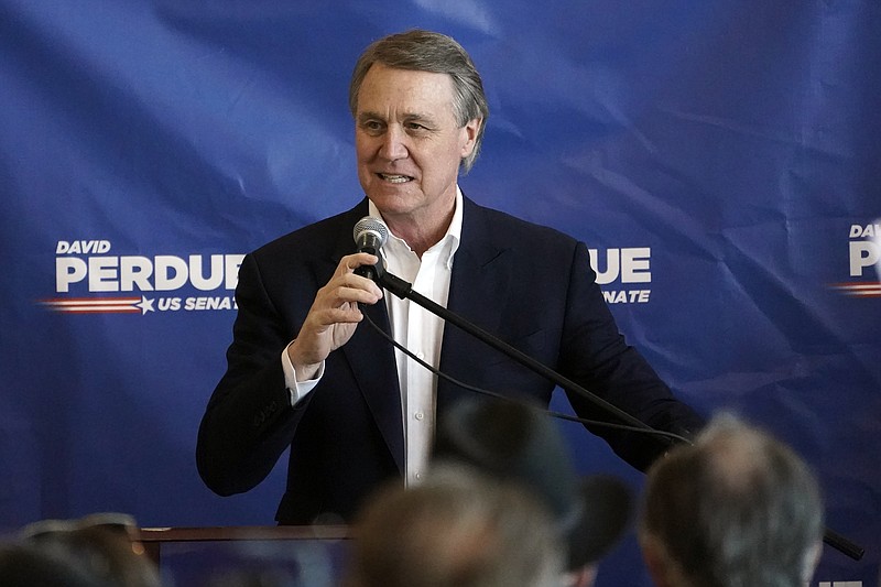 Republican candidate for Senate Sen. David Perdue speaks during a campaign stop at Peachtree Dekalb Airport Monday, Nov. 2, 2020, in Atlanta. (AP Photo/John Bazemore)