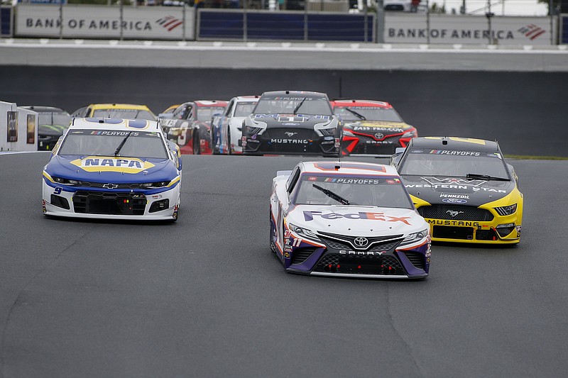 AP photo by Nell Redmond / From left, NASCAR Cup Series drivers Chase Elliott, Denny Hamlin and Brad Keselowski race on Oct. 11 at Charlotte Motor Speedway in Concord, N.C. Those three drivers and Joey Logano are eligible for the title in Sunday's season finale at Phoenix Raceway, with the championship going to the one with the best finish in the desert.