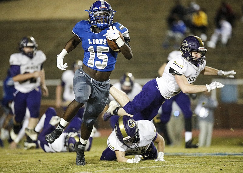 Staff photo by Troy Stolt / Red Bank running back Lumiere Strickland (15) runs for a touchdown during the Lions' home game against Grundy County on Friday night in the first round of the TSSAA Class 3A state playoffs.