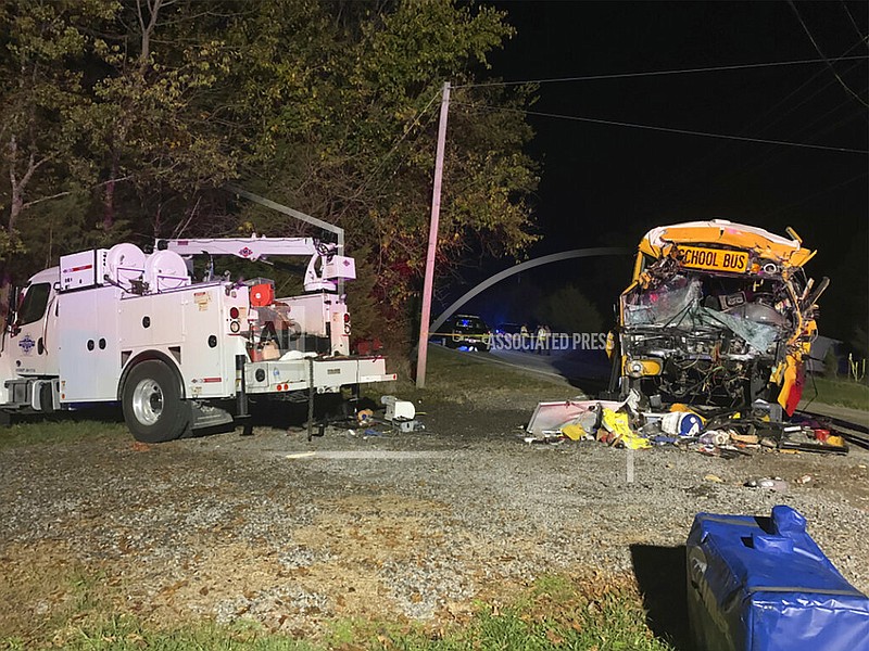This photo provided by the Tennessee Highway Patrol shows the scene of deadly crash involving a utility vehicle and a school bus carrying children on Tuesday evening, Oct. 27, 2020, in Decatur, Tenn. (Tennessee Highway Patrol via AP)