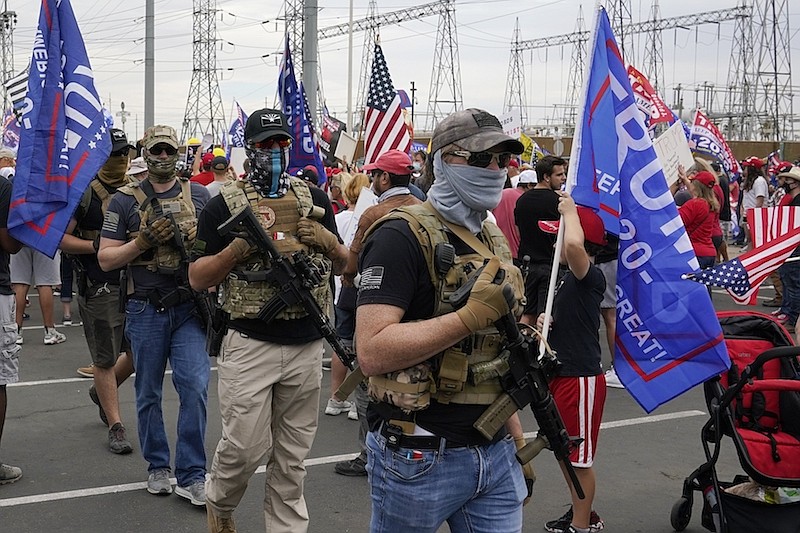 Supporters of President Donald Trump rally outside the Maricopa County Recorder's Office, Friday, Nov. 6, 2020, in Phoenix. (AP Photo/Ross D. Franklin)