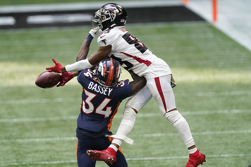 AP photo by John Bazemore / Atlanta Falcons wide receiver Russell Gage leaps but is unable to make the catch over Denver Broncos defensive back Essang Bassey during the second half of Sunday's game in Atlanta.