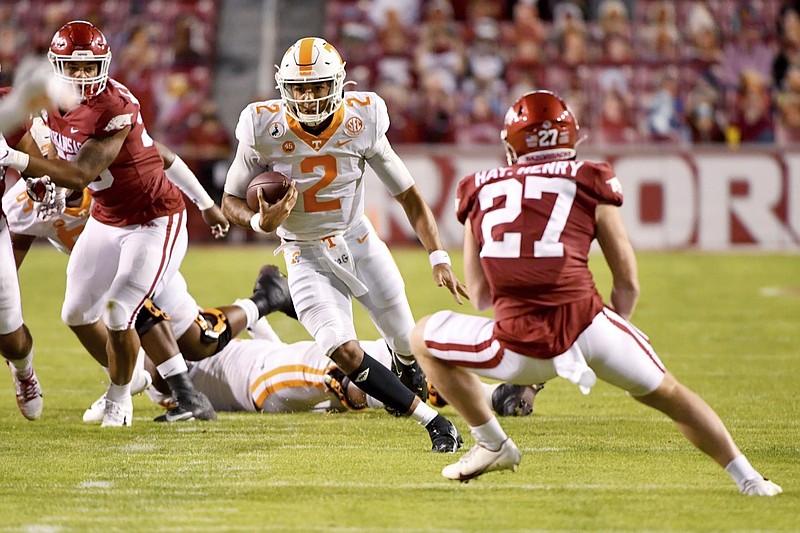 Tennessee quarterback Jarrett Guarantano (2) runs for a gain against Arkansas during the first half of an NCAA college football game Saturday, Nov. 7, 2020, in Fayetteville, Ark. (AP Photo/Michael Woods)