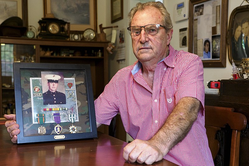 Staff photo by C.B. Schmelter / Veteran Larry Presnell sits for a photograph at his home on Monday, Oct. 26, 2020, in Rossville, Ga.