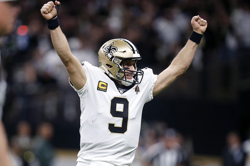 FILE  - New Orleans Saints quarterback Drew Brees (9) celebrates a touchdown carry by Alvin Kamara in the first half of an NFL wild-card playoff football game against the Minnesota Vikings in New Orleans, in this Sunday, Jan. 5, 2020, file photo. With the NFC East a total mess, the conference's West Division is so strong that three teams, possibly all four, figure to challenge for the playoffs. (AP Photo/Butch Dill, FiIe)