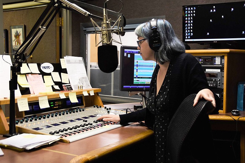 Haley Solomon, a producer and host at WUTC radio, helps patrons who qualify for the "DJ for an Hour" promotion. Contributed photo by Lauren Solomon.