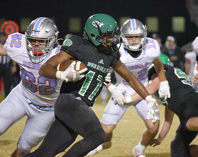 Staff photo by Matt Hamilton / East Hamilton's Juandrick Bullard avoids Sullivan South defenders during last Friday's TSSAA Class 4A playoff game in Ooltewah. The Hurricanes, who won 56-20, hit the road this week for a second-round matchup against undefeated Elizabethton.