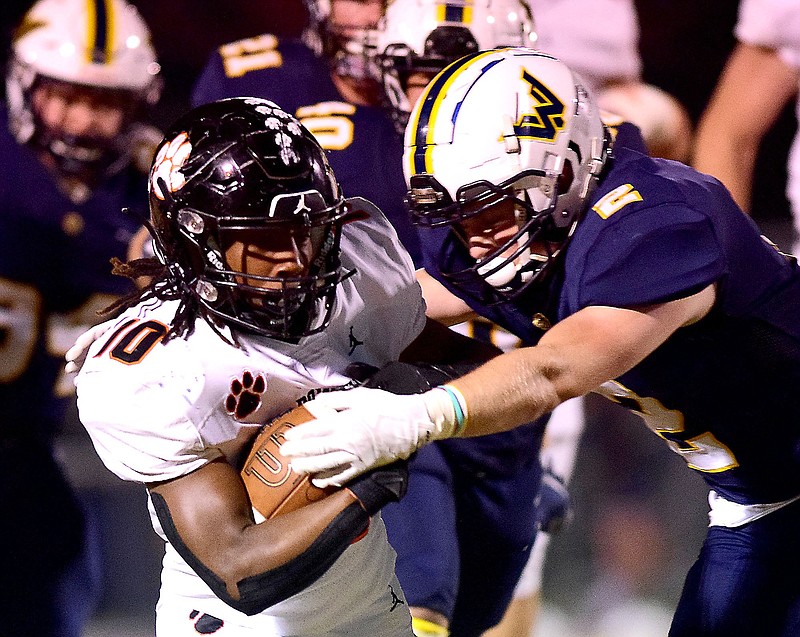 Staff photo by Robin Rudd / Walker Valley's Spencer Jackson, right, stops Knoxville Powell's Jarvis Stockton Jr. after a long run during last Friday's first-round game in the TSSAA Class 5A playoffs. Walker Valley won 21-16 to reach eight wins in a season for the first time in program history.