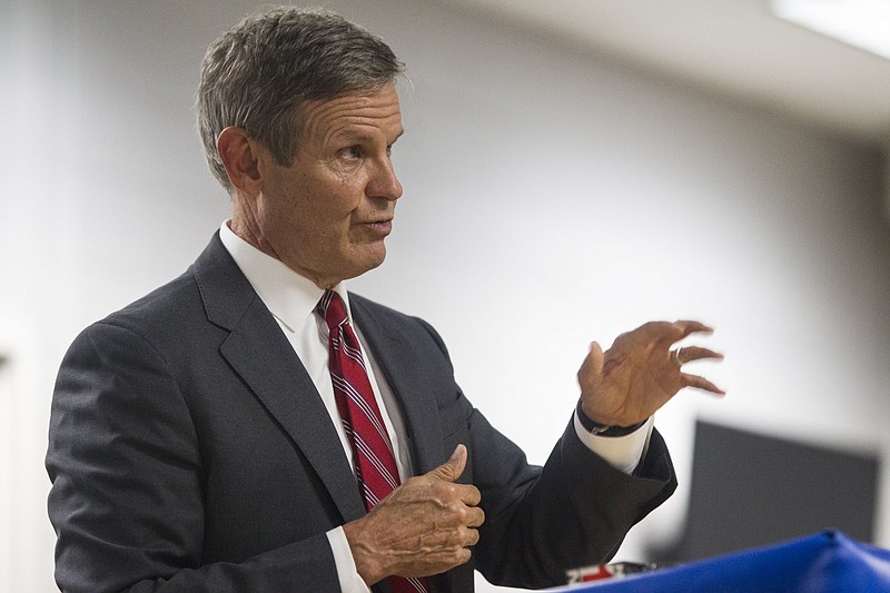 Staff photo by Troy Stolt / Gov. Bill Lee speaks at a podium inside of Cleveland High School's library during a visit on Thursday, Oct. 29, 2020 in Cleveland, Tenn.