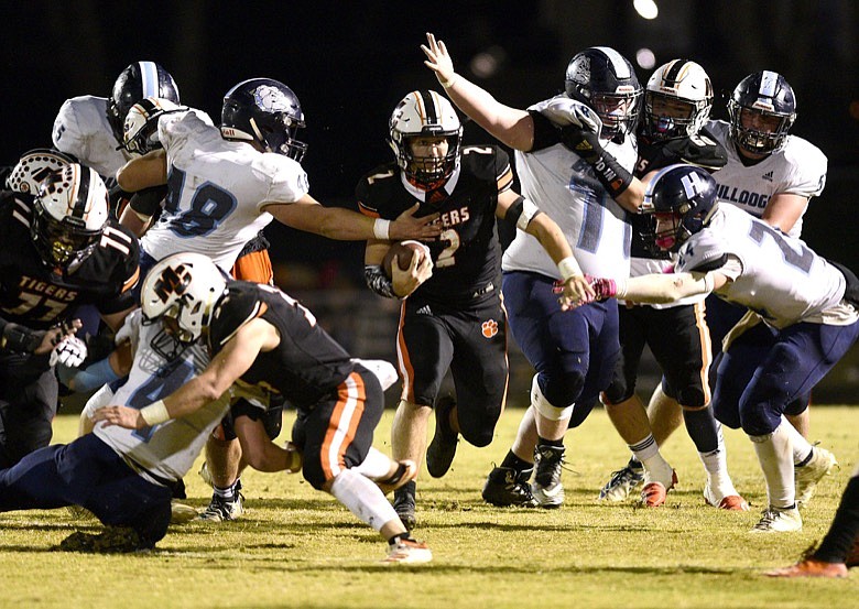 Staff photo by Robin Rudd / Meigs County quarterback Logan Carroll finds a hole in Hampton's defense during a TSSAA Class 2A game in the second round of the state playoffs Friday night in Decatur, Tenn.