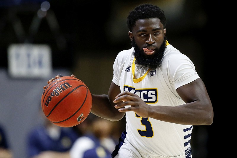 Staff photo by C.B. Schmelter / UTC guard David Jean-Baptiste, a preseason All-SoCon selection, returns this season as a fifth-year senior for the Mocs.