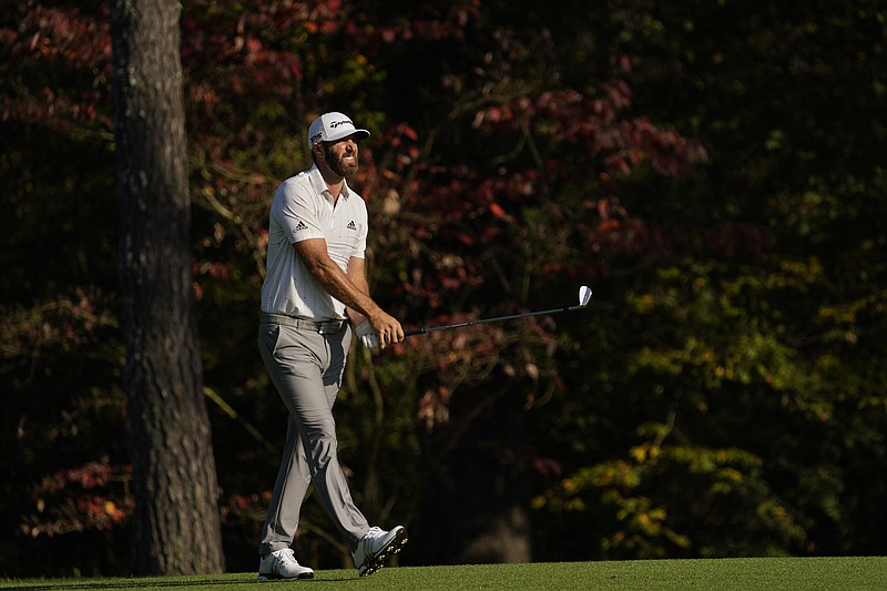 AP photo by David J. Phillip / Dustin Johnson watches his second shot on the 11th hole at Augusta National Golf Club during the third round of the Masters on Saturday. Johnson made an eagle and two birdies in his first four holes as he took control of the tournament on his way to tying the 54-hole record at 16-under-par 200.