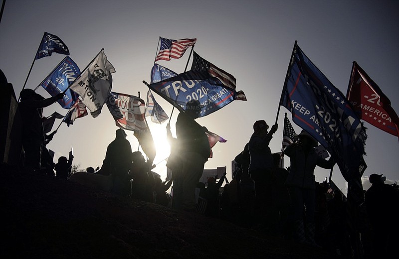 FILE - In this Nov. 8, 2020, file photo supporters of President Donald Trump protest the election outside of the Clark County Election Department in North Las Vegas. Republican leaders in four critical states won by President-elect Joe Biden say they won't participate in a legally dubious scheme to flip their state's electors to vote for President Donald Trump. Their comments effectively shut down a half-baked plot some Republicans floated as a last chance to keep Trump in the White House. (AP Photo/John Locher, File)


