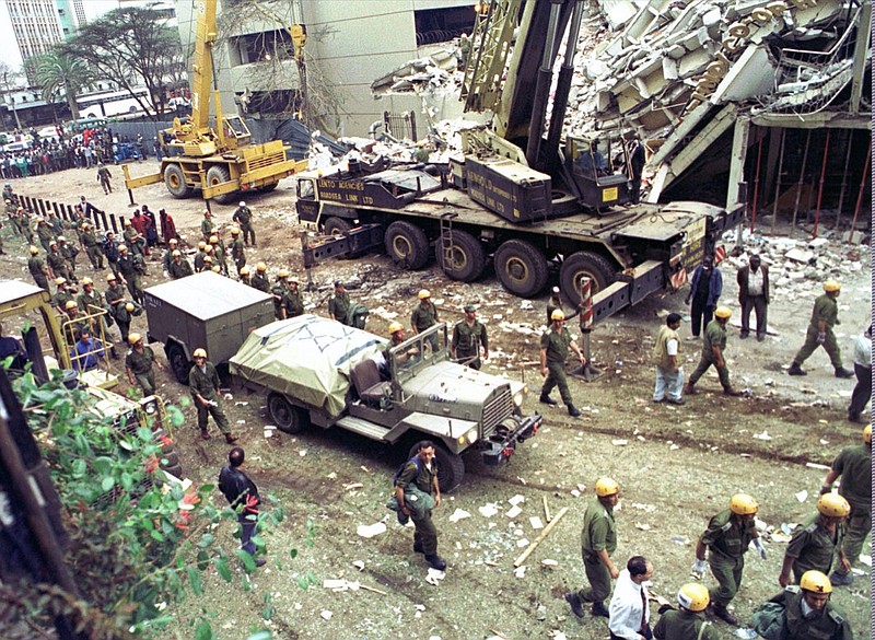 FILE - In this Sunday, Aug. 9, 1998 file photo, Israeli soldiers bring in heavy lifting equipment to the wreckage of the Ufundi House, adjacent to the U.S. embassy in Nairobi. The United States and Israel worked together to track and kill Abu Mohammed al-Masri, a senior al-Qaida operative in Iran earlier this year, a bold intelligence operation by the two allied nations that came as the Trump administration was ramping up pressure on Tehran. Al-Masri was gunned down in a Tehran alley on August 7, 2020 the anniversary of the 1998 bombings of the U.S. embassies in Nairobi, Kenya, and Dar es Salaam, Tanzania. Al-Masri was widely believed to have participated in the planning of those attacks and was wanted on terrorism charges by the FBI. (AP Photo/Sayyid Azim, File)