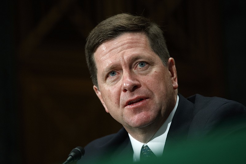 FILE - In this Dec. 10, 2019 file photo, Securities and Exchange Commission (SEC) Chairman Jay Clayton testifies to the Senate Committee on Banking, Housing, and Urban Affairs about oversight of the SEC, on Capitol Hill in Washington. Clayton, a former Wall Street lawyer who has headed the Securities and Exchange Commission as the financial markets’ top regulator during the Trump administration, is leaving the position at year’s end. Clayton’s term runs through mid-2021. (AP Photo/Jacquelyn Martin, File)