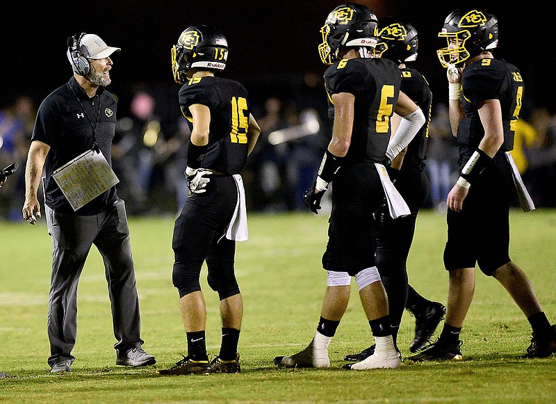 Staff Photo by Robin Rudd /  McMinn head coach Bo Cagle tries to rally his offense.  The McMinn County Cherokees hosted the Maryville Rebels in a battle of two top-five TSSAA football teams on October 23, 2020.  