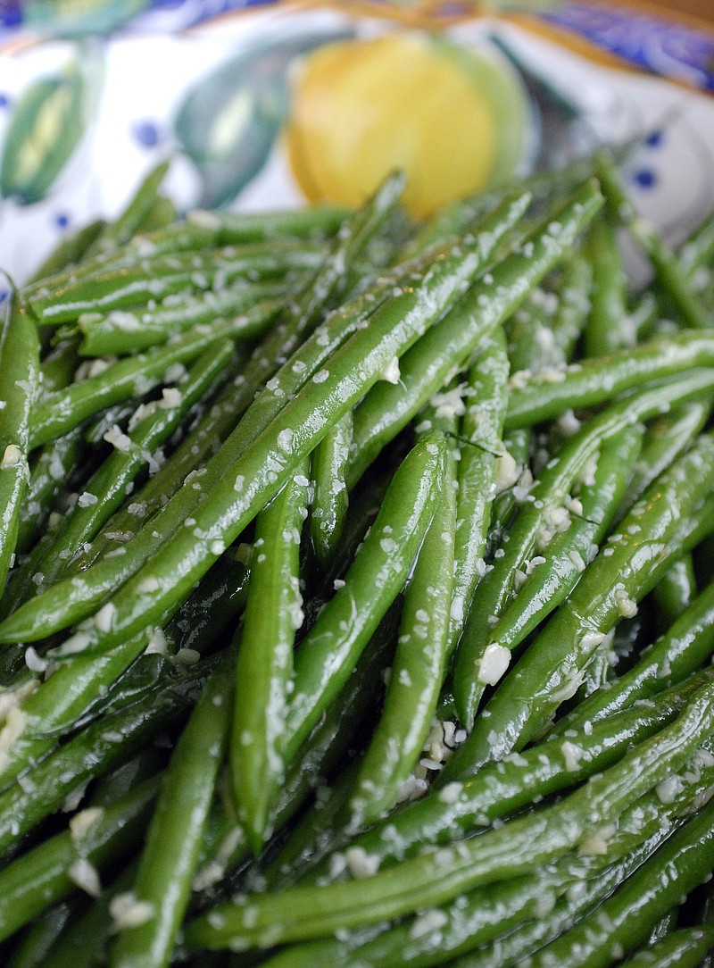 The recipe for Green Beans With Ginger and Garlic works especially well with French-style slim haricots verts. / Photo by Evan Sung/The New York Times