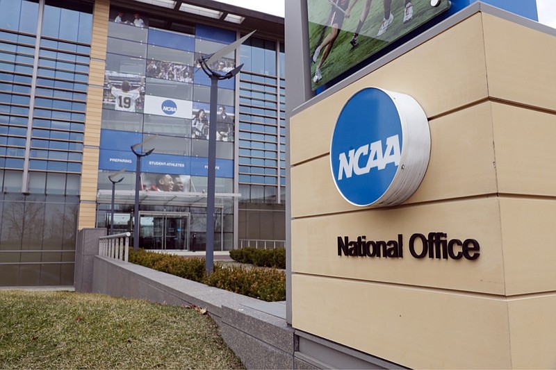 FILE - In this March 12, 2020, file photo, the national office of the NCAA in Indianapolis is shown. The NCAA announced Monday, Nov. 16, 2020, it plans to hold the entire 2021 men's college basketball tournament in one geographic location to mitigate the risks of COVID-19 and is in talks with Indianapolis to be the host city. (AP Photo/Michael Conroy, File)