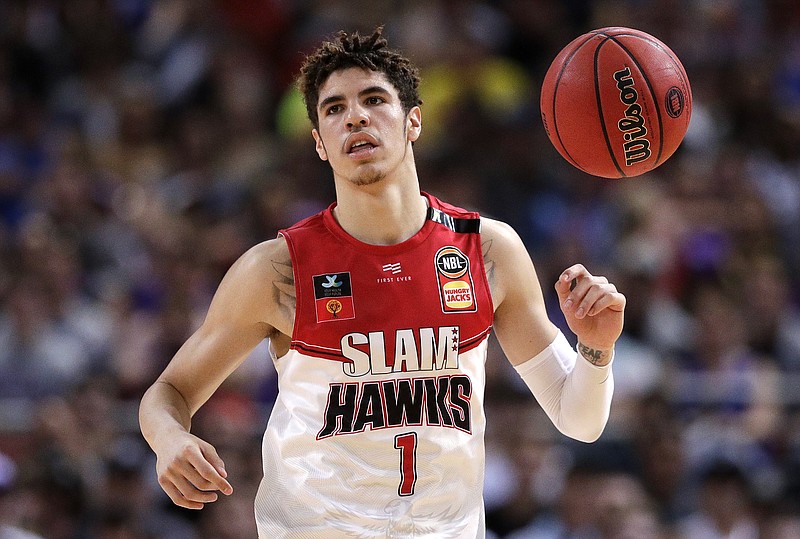 FILE - In this Nov. 17, 2019, file photo, LaMelo Ball of the Illawarra Hawks brings the ball up during a game against the Sydney Kings in the Australian Basketball League in Sydney. Ball is expected to be the first point guard taken and possibly the No. 1 overall pick in the NBA draft on Nov. 18, 2020. (AP Photo/Rick Rycroft, File)