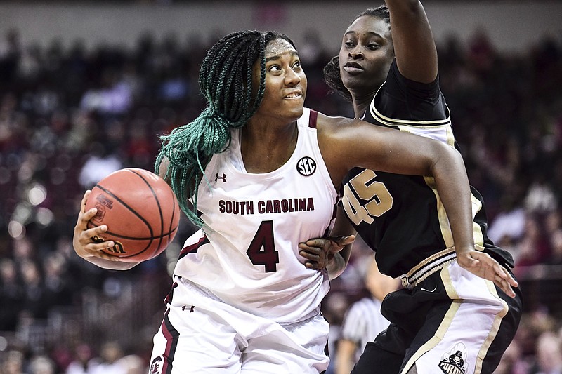 AP photo by Sean Rayford / South Carolina forward Aliyah Boston drives to the basket while guarded by Purdue center Fatou Diagne on Dec. 15, 2019, in Columbia, S.C.