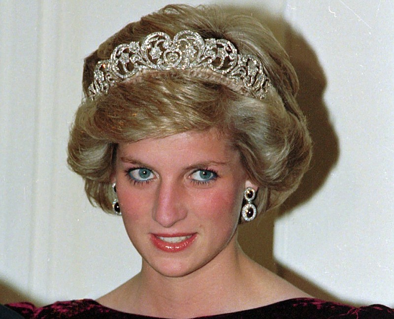 FILE - In this file photo dated Nov. 7, 1985, Britain's Princess Diana wears the Spencer tiara as she and Prince Charles attend state dinner at Government House in Adelaide, Austraila. The BBC's board of directors has announced Wednesday Nov. 18, 2020, the appointment of a retired senior judge to lead an independent investigation into the circumstances around a controversial 1995 TV interview with Princess Diana. (AP Photo/Jim Bourdier, FILE)