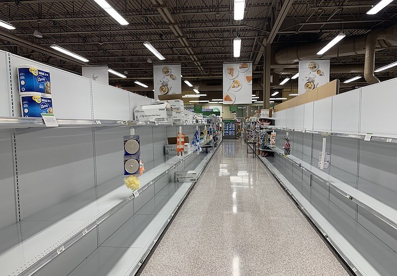 Shelves in the toilet paper and paper towel aisle are depleted at the Publix on Gunbarrel Road in Chattanooga on Wednesday, Nov. 18, 2020. / Staff photo by Allison Collins
