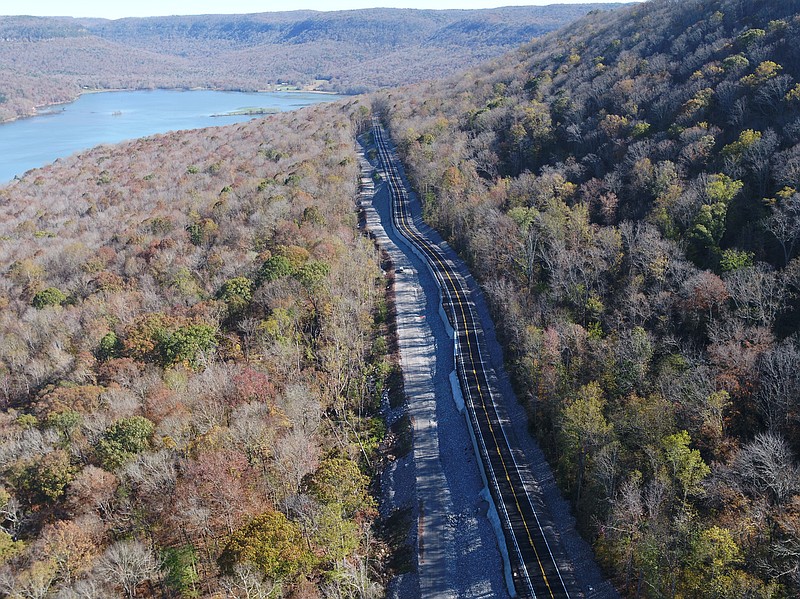 Contributed photo / The $19.2 million mile-long slide repair project on U.S. Highway 41 in Marion County, Tenn., is finally complete and open to traffic in both directions, according to the Tennessee Department of Transportation. Shown here on Wednesday, Nov. 18, in a TDOT drone photo, the now-repaired section features new geomembrane-lined ditches and drainage systems to help divert enormous amounts of rain runoff that runs downhill toward the road. An access road parallels Highway 41 so crews can monitor drainage and perform other activities. The access road also will provide a site for water to discharge without washing away the slopes, TDOT says.