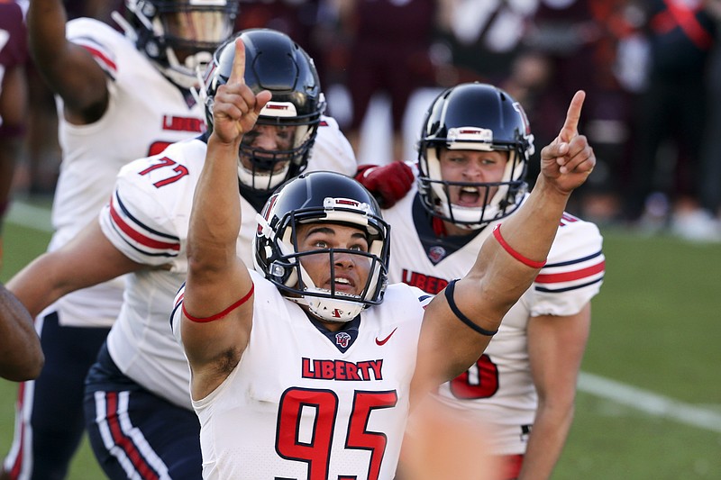 AP photo by Matt Gentry / Liberty kicker Alex Barbir celebrates after making a last-second field goal in the Flames' 38-35 win at Virginia Tech on Nov. 7. Liberty is 8-0 and No. 21 in the AP Top 25 this week.