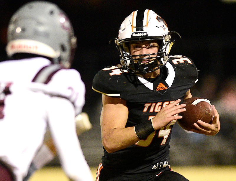 Staff photo by Robin Rudd / Meigs County's Will Meadows carries the ball during the Tigers' home game against South Greene in the TSSAA Class 2A quarterfinals Friday night in Decatur, Tenn.