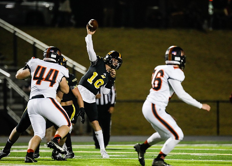 Staff photo by Troy Stolt / North Murray quarterback Seth Griffin passes during Friday night's regular-season finale against GHSA Region 6-AAA foe LaFayette in Chatsworth, Ga. Griffin threw four touchdown passes to help the Mountaineers win 49-42 and secure the region's No. 3 seed for the state playoffs. LaFayette wound up as the No. 4 seed, and both teams will travel next week.