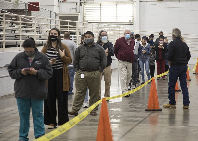 Staff photo by Troy Stolt / East Ridge residents wait in line to vote at Camp Jordan Arena on Tuesday, Nov. 3, 2020, in East Ridge, Tenn.