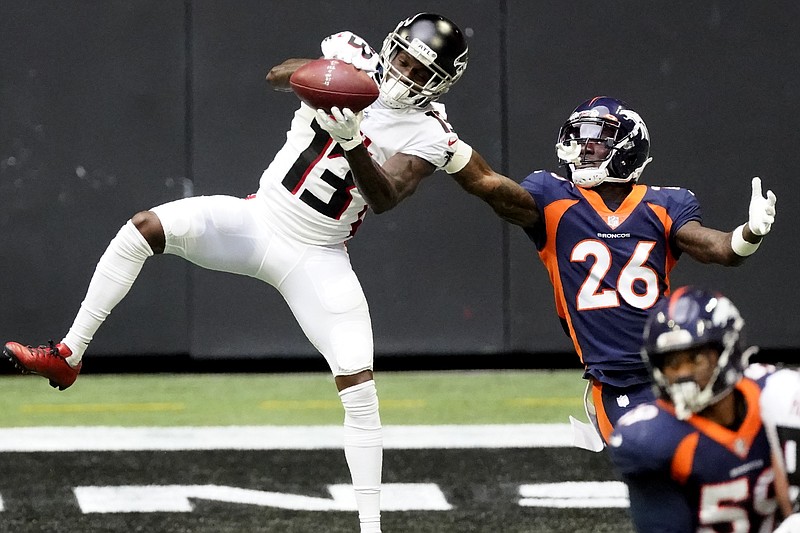 AP photo by John Bazemore / Atlanta Falcons wide receiver Christian Blake makes a catch while covered by Denver Broncos defensive back Kevin Toliver on Nov. 8 in Atlanta. The Falcons won 34-27, their third victory in four games under interim head coach Raheem Morris, and after being off last weekend, they're set to visit the New Orleans Saints.