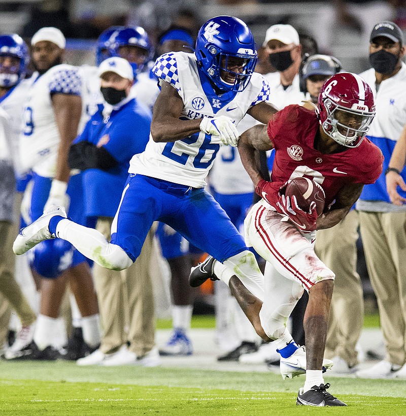 AP photo by Mickey Welsh / Alabama wide receiver DeVonta Smith makes a catch behind Kentucky defensive back Brandin Echols during Saturday night's SEC matchup in Tuscaloosa. Smith had nine catches for 144 yards and two touchdowns to help the top-ranked Crimson Tide win 63-3.