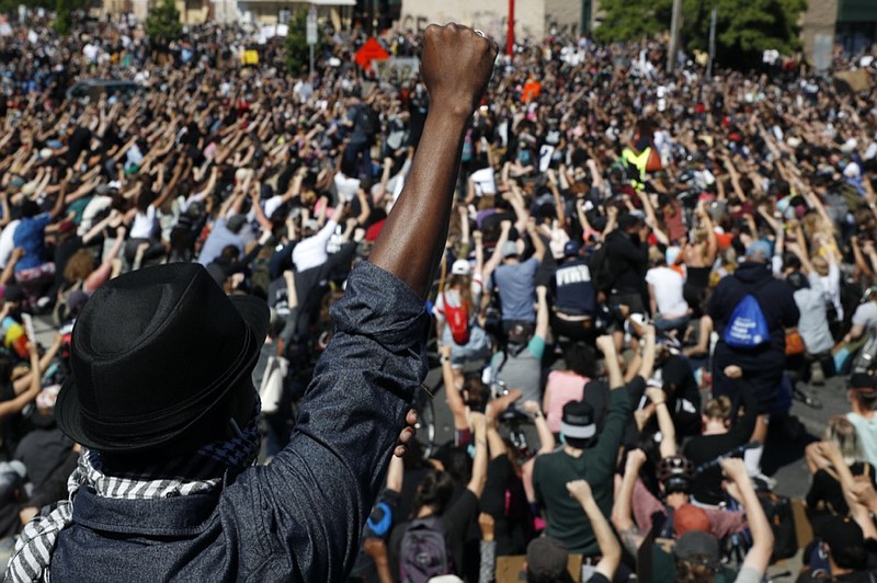 FILE - In this May 30, 2020, file photo, protesters gather in Minneapolis. Almost six months after the death of George Floyd, criminal justice reform advocates are cheering multiple victories in the 2020 election. (AP Photo/John Minchillo, File)


