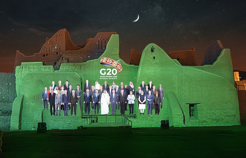 In this handout image provided by DGDA, Diriyah Gate Development Authority of Saudi, a family photo featuring members of the G20 is projected onto the walls of Salwa Palace, At Turaif on Saturday, Nov. 20, 2020 in Diriyah, on the outskirts of Riyadh, Saudi Arabia. (Meshari-Alharbi, DGDA via AP)



