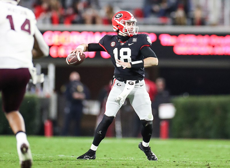 Georgia photo by Chamberlain Smith / Quarterback JT Daniels threw for 401 yards and four touchdowns during his Georgia debut Saturday night, leading the Bulldogs to a 31-24 home win over Mississippi State.