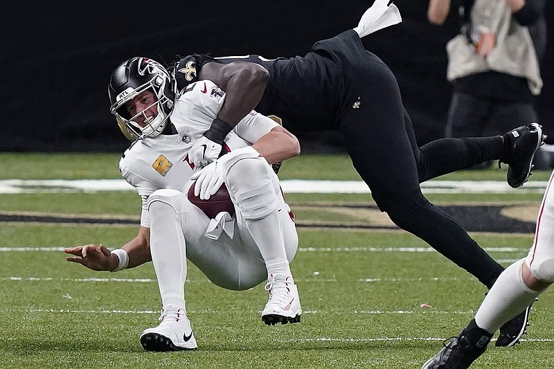 AP photo by Butch Dill / Atlanta Falcons quarterback Matt Ryan is sacked by New Orleans Saints outside linebacker Demario Davis in the second half of Sunday's game in New Orleans. The Saints sacked Ryan eight times as the Falcons lost 24-9.