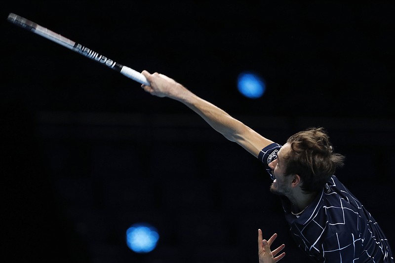 AP photo by Frank Augstein / Daniil Medvedev serves to Dominic Thiem during the ATP Finals singles championship match Sunday at the O2 Arena in London. Medvedev prevailed 4-6, 7-6 (2), 6-4 to win the season-ending tournament for the first time.