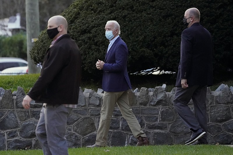 President-elect Joe Biden leaves St. Ann Parish, Saturday, Nov. 21, 2020, in Wilmington, Del. (AP Photo/Alex Brandon)