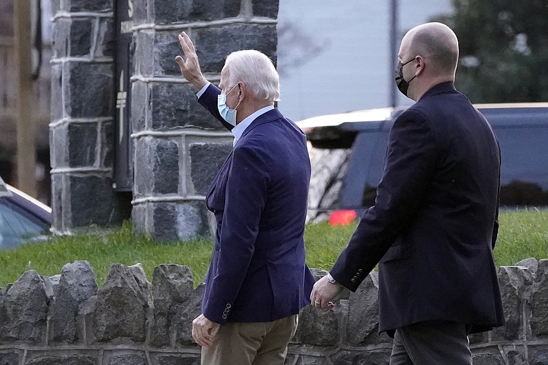 Photo by Alex Brandon of The Associated Press / President-elect Joe Biden waves to supporters as he leaves St. Ann Parish Catholic Church on Saturday, Nov. 21, 2020, in Wilmington, Delaware.